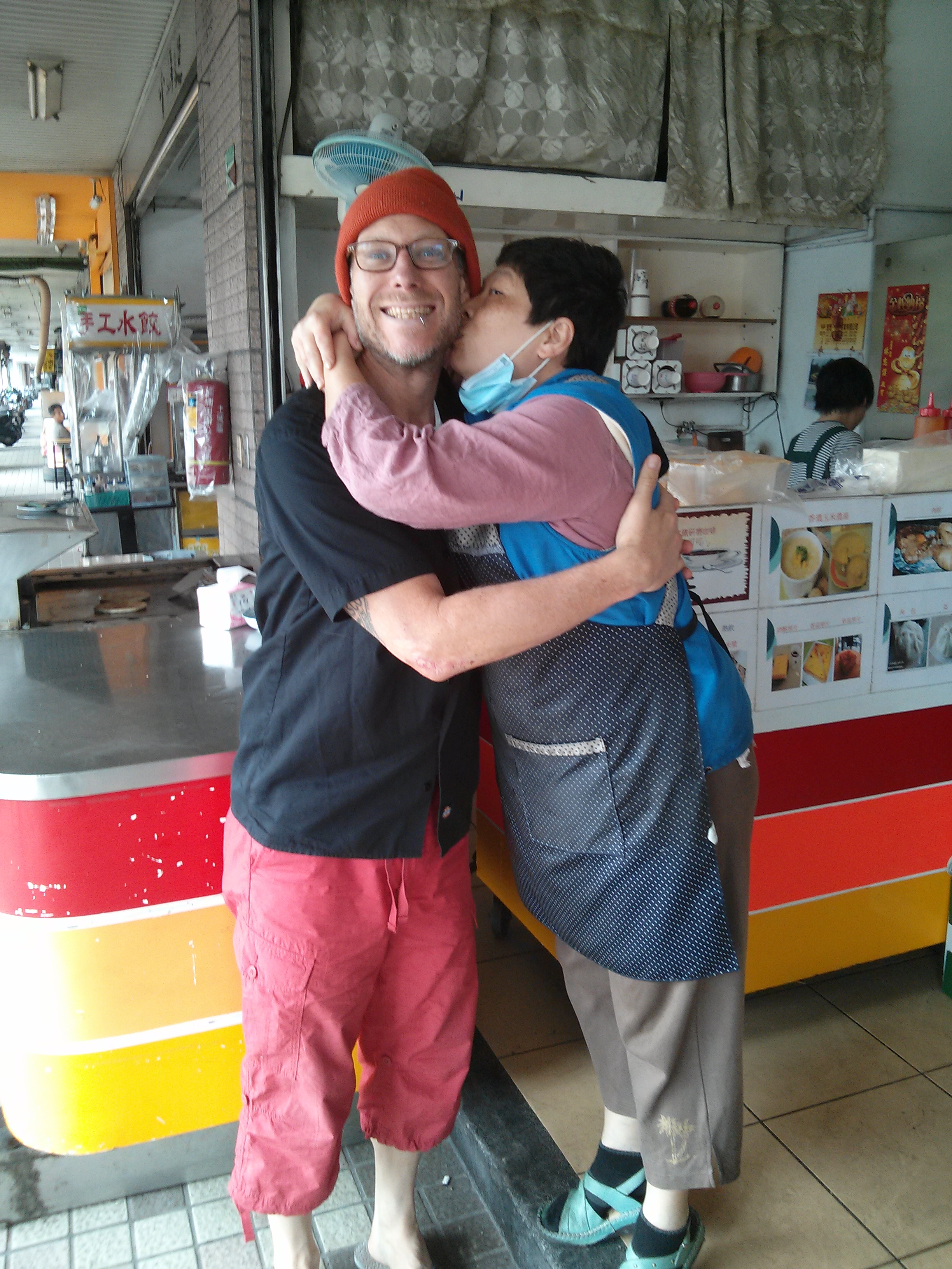 Ingy smiling with a friend in a coffee shop